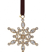 Create a winter wonderland like no other with the Ice Queen Snowflake ornament from kate spade new york. Dazzling crystal gems set in gold plate lend unparalleled shine to the season. With spade charm.