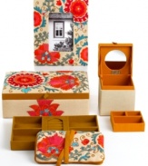 Put precious trinkets in their place with this elegant Tea Dip jewelry roll from Purva. Pretty floral embroidery keeps necklaces, bracelets and rings stashed away in style.