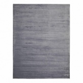 An understated and elegant hand-loomed Calvin Klein rug in a velvety ribbed texture with a silky finish and subtle sheen.