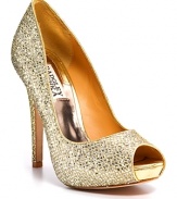 Add some glamour to a simple dress. Goldtone glitter peeptoe pumps with a tall covered heel and platform.