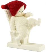 Hoping to step out in some new kicks this Christmas, this precious snowbaby sits back to get sized on a porcelain bisque chair from Department 56.