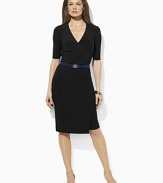The season's new classic is rendered in fluid matte jersey in a faux-wrap silhouette that flatters the figure.