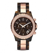 An ultra-stylish timepiece from MICHAEL Michael Kors with crystal-embellished bezel and tortoise and rose gold tone bracelet.