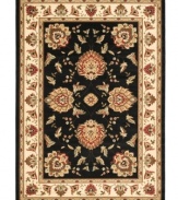 Bring the brilliance of ancient Persian textile design home with this dark and captivating Lyndhurst area rug from Safavieh. Crafted from soft polypropylene, this rug radiates timeless allure with the added convenience of easy-care construction. (Clearance)