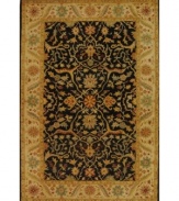 Enjoy a thousand years of rug-making tradition -- set against a bold black ground -- with this striking area rug from Safavieh. Tufted in India from pure wool, this rug emerges from the annals of antiquity to bring spectacular style and time-honored quality to your home. (Clearance)