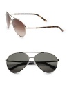 A classic aviator style with tubular temple and double bridge featuring the celebrated Prada signature logo. Available in gold with brown lens or gunmetal with grey lens. Metal UV 400 lens 100% UV protection Made in Italy