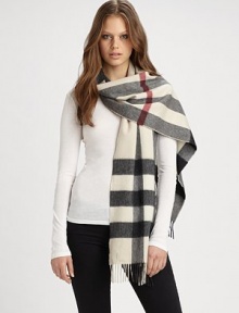 A beautiful cashmere style with an signature print and fringe details. CashmereAbout 14 X 79Dry cleanImported 