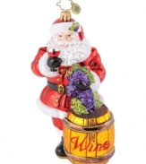 Spread good cheer. Santa swirls like a pro and gives the first toast in a Christopher Radko ornament that's all about merriment.