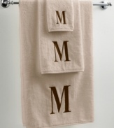 Dry off in your signature style with monogrammed towels from Avanti. Embroidered with a single capital letter in Bodoni font, this linen and brown towel set makes it easy to personalize your bath.