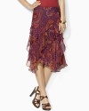 Tiers of ruffles and a sweeping paisley pattern enliven a fluid silk georgette skirt.