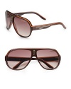 Sporty plastic shield frames with signature stripe logo detail. Available in black crystal orange with grey gradient lens, brown crystal yellow with brown grey gradient lens or brown white with brown gradient lens. Injected propionate lens 100% UV protection Imported 