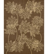 Enhance your living area with the beautiful look and sheen of Nourison's Capri rug. Woven of a blend of fine wool with Nourison's signature light-reflecting Luxcelle(tm) fibers, the luminous rug features a delicate leafy design across a rich chocolate background.