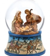 A delightful keepsake for family and friends, this religious snow globe depicts Mary and Joseph at the birth of baby Jesus. The blue-trimmed etched base features the three wise men atop camels, journeying to deliver gifts to the newborn.