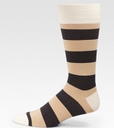 Bold stripes add color and warmth underfoot.Mid-calf heightRibbed cuff72% cotton/26% nylon/2% spandexMachine washImported