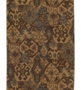 Abstract designs inspired by ancient tribal artwork are arranged in a dazzling way upon this Kulshan area rug from Karastan. Woven of rich New Zealand wool for supreme softness and lasting durability.