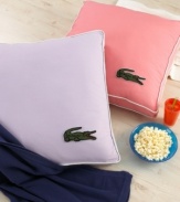 Recline in style! The perfect oversized pillow for lounging features a hip embellished Lacoste croc in the corner. (Clearance)