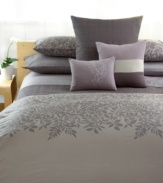 A bold and intricate pattern of leaves overlaps a checkered tonal background of printed tone-on-tone hues in this ornate Calvin Klein comforter set. Featuring 250 thread count cotton sateen in muted, modern colors, this set brings natural sophistication to your bedroom. The lavish leaf print adorns most of the comforter.