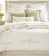 Featuring intricate embroidery and a patchwork quilt style where each piece has an individually unique design, this sham from Martha Stewart Collection creates a simply elegant air.