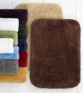 Classic comfort. Plush, Comforel nylon provides a sweet retreat for your feet in this sumptuously soft Charter Club lid bath rug. Choose from a lush array of bleach-and-stain resistant hues.