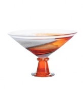 A unique piece that enhances a table or mantelpiece and serves as a majestic display for assorted fruit, this handcrafted bowl from one of the leading glass houses is graced with radiant hues of rust and orange ascending from base to mouth. 7 1/2 tall. Imported.