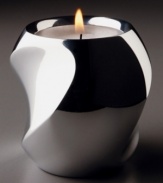 Light up your life with Nambe's twist votive candle holder. Its modern curved shape is rendered in alloy metal. Measures 3 inches tall.