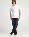 he standard against all other jeans will be measured in dark-washed denim with a relaxed fit and straight legs. Distressed details and slight fading add a coveted worn-in look. Five-pocket style Sits higher on the waist Embroidered design on the back pockets Inseam, about 33 inseam 98% cotton/2% spandex; machine wash Imported 