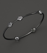 A modern sterling silver bangle with clear quartz stations from Ippolita.