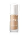 Engineered with weightless color and La Mer's remarkable skincare benefits, this silken, lightweight fluid has the power to transform the complexion. Gemstones capture light energy to create a translucent color palette, optically erasing imperfections to reveal a naturally flawless complexion. Created with a rare blue algae, a Blue Algae Lift Ferment and precious marine and plant actives to add radiance, lift the skin and restore lasting clarity, firmness and brightness. Flexible medium coverage brings skin a naturally luminous finish. Protects with SPF 15.