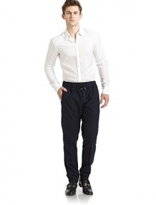 THE LOOKWide elastic waistband with drawstring tiesButton flyDual seam pocketsElastic cuffsBack flap pocketTHE FITRise, about 10Inseam, about 29½THE MATERIAL62% cotton/38% woolCARE & ORIGINDry cleanMade in Italy