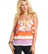 Soak-up some rays in this femme and colorful top from GUESS?, where a bodice of asymmetrical ruffles compliments a relaxed silhouette!