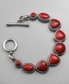 Add a burst of color to any ensemble with this earthy red bracelet from Lucky Brand. In silvertone mixed metal with red howlite stones. Measures approximately 7-5/8 inches long.