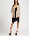 A design tailored to provide a feminine fit while maintaining a fashion-forward presence with the help of an angled hem.Shawl collarFlap front pocketAbout 24 from shoulder to hem92% cotton/8% elastaneDry cleanMade in USA of imported fabric Model shown is 5'9½ (176cm) wearing US size 4. 