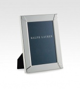 A single-photo frame is beautifully crafted from smooth, silver-plated brass with elegant embossing at the corners, creating the perfect home for a treasured memory.Silver plated brassClean with a soft clothImported