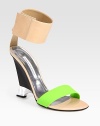 Stunning colorblock leather design with an architectural wedge and wrap-around ankle strap. Self-covered wedge, 5 (125mm)Leather upperLeather lining and solePadded insoleMade in ItalyOUR FIT MODEL RECOMMENDS ordering true size. 