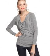 The cowl neck top from GUESS? has a casual fit that looks great with dark wash jeggings and embellished flats.