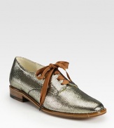 Traditional oxford rejuvenated by lustrous metallic leather and oversized laces. Metallic leather and lurex upperLeather lining and solePadded insoleMade in France