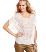 An intricate design of metallic studs brings tribal sensibility to XOXO's wispy, short-sleeve top!