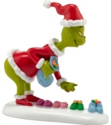 Up to no good, the wicked Grinch steals candy from tiny Who shoes before he's filled with the spirit of Christmas. With bright color and true-to-Seuss detail, this Department 56 figurine is a must from Grinch Village.