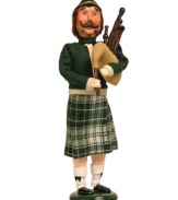 Piping and singing along with his fellow carolers, the Eleven Pipers Piping figurine is an essential companion to the Twelve Days of Christmas collection by Byers' Choice. Handcrafted with a jolly expression, Christmas-plaid kilt and crisp white knee socks.