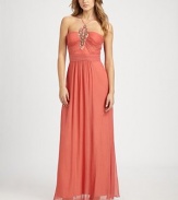 Airy chiffon in a floor length silhouette, accented with a prettily beaded front.Halter style neckline with spaghetti strapsBeaded front detailRuched bodiceBanded waistConcealed back zipFully linedAbout 45 from natural waistPolyesterSpot cleanImportedModel shown is 5'10 (177cm) wearing US size 4. 