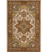 An elegant pattern, this Nourison rug features a design that melds classic Persian motifs with chic, natural color. With its opulent 100% natural wool construction, this yarn-dyed and meticulously hand-tufted rug offers a beautiful accent to traditional home décor.