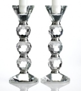 Towers of faceted crystal balls and polished metal rings, the Afterglow candle holders cast modern decor in a glamorous new light. A dazzling gift for brides!