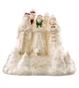 Make the townsfolk of Mistletoe Park Village sing with the addition of this fine porcelain figurine. A troupe of traditional Christmas carolers evokes the most cherished sounds of the season. With gold detail and glitter. Qualifies for Rebate