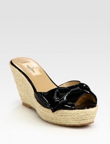 Pretty in patent leather with bow detail at the open toe.Rope-covered heel, 3½ (90mm) Rope-covered platform, 1½ (40mm) Compares to a 2 heel (50mm) Leather lining Padded insole Rubber sole Made in ItalyOUR FIT MODEL RECOMMENDS ordering one half size up as this style runs small. 