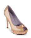 This flattering open toe pump adds finesse to any look. From Cole Haan.