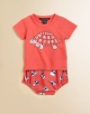 A smiling turtle on this vibrant, soft cotton tee adds a whimsical touch. Envelope neckline with snap closure for easy fitShort sleevesCottonMachine washImported