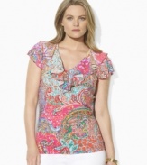A chic plus size V-neck jersey top is trimmed with a flourish of ruffles at the neckline and delicate flutter sleeves, from Lauren by Ralph Lauren.
