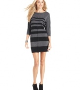 Solid stripes on metallic knit makes a big impact on this sleek sweater dress from DKNY Jeans.