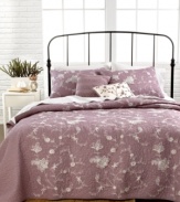 Pretty florals cascade down a plush quilted ground in this Viola quilt from Nostalgia Home for a casual, relaxed presentation in your space.
