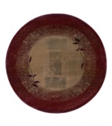 A larger-diameter round ideal for open spaces. This rug features a striking design of two vines in silhouette against a ground of rectangles framed with borders. Hues of sage green, gold, beige and russet blend into each other with striations and stain-like effects to impart a weathered, timeworn feel.